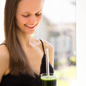 Petra Scott drinking a green smoothie