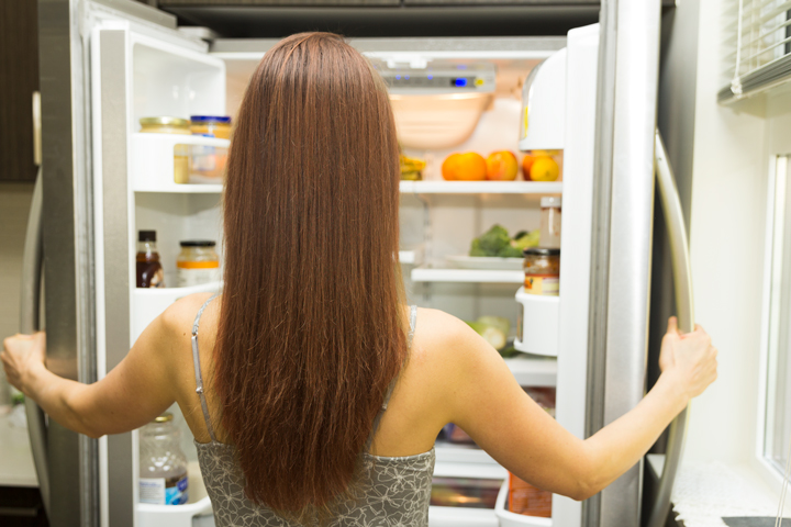 Petra Scott looking into an open fridge