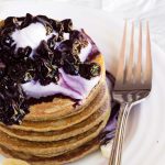raw pancakes with blueberry sauce and whipped cream