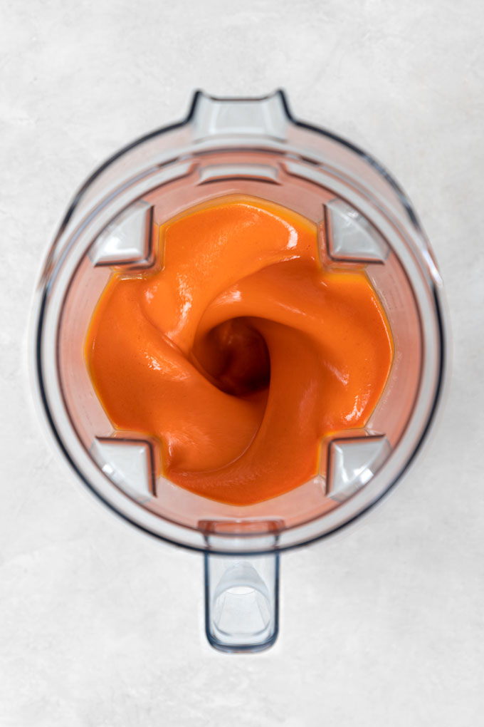 blending red pepper soup in a Vitamix blender